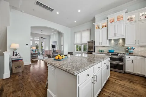 a kitchen with stainless steel appliances granite countertop a lot of counter space sink and stove
