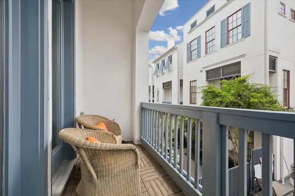 a balcony view with a seating space