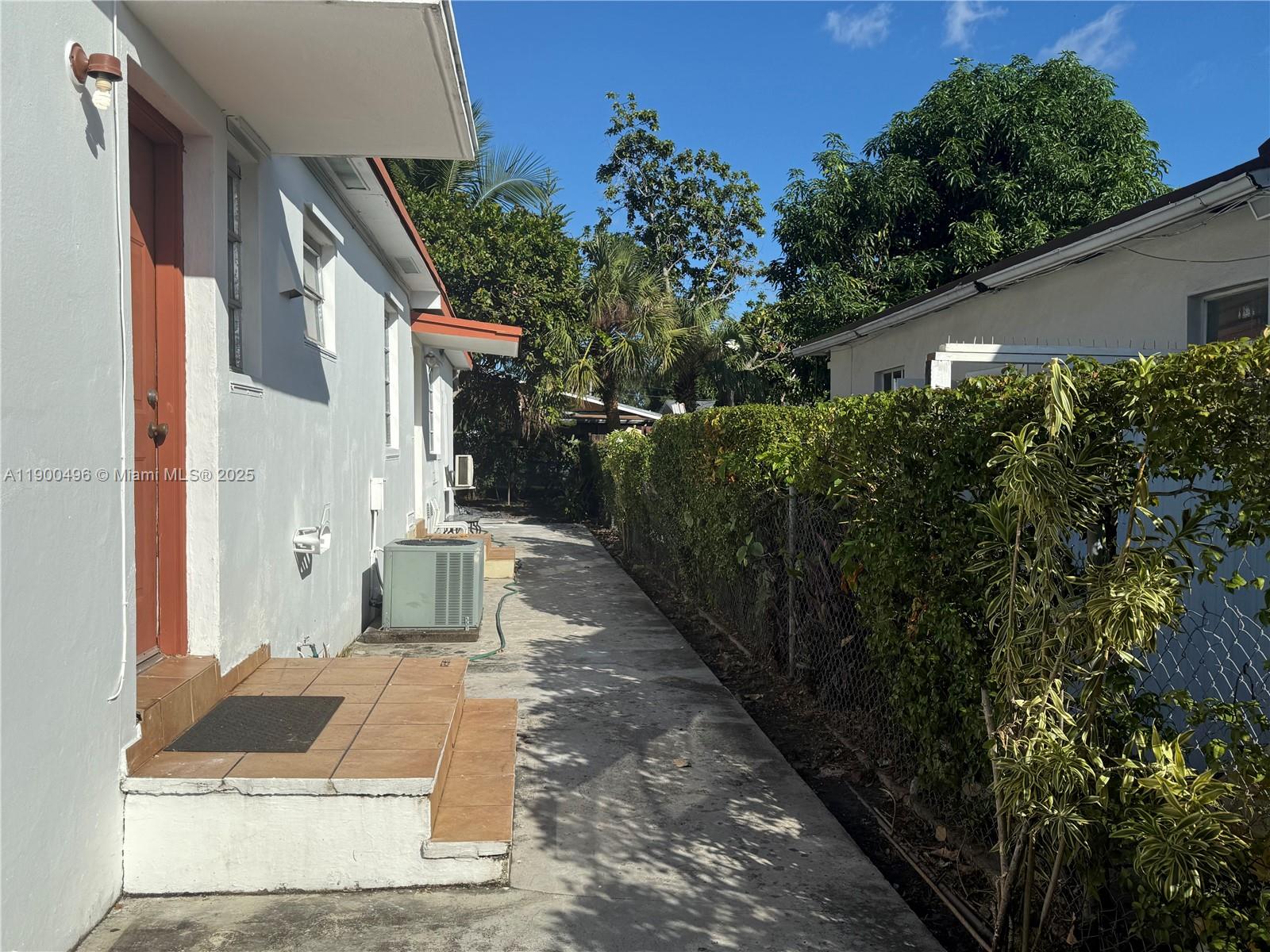 233 Northwest 45th Avenue, Unit 233 Miami, FL 33126 - Photo 11 of 11 a view of a house with a yard