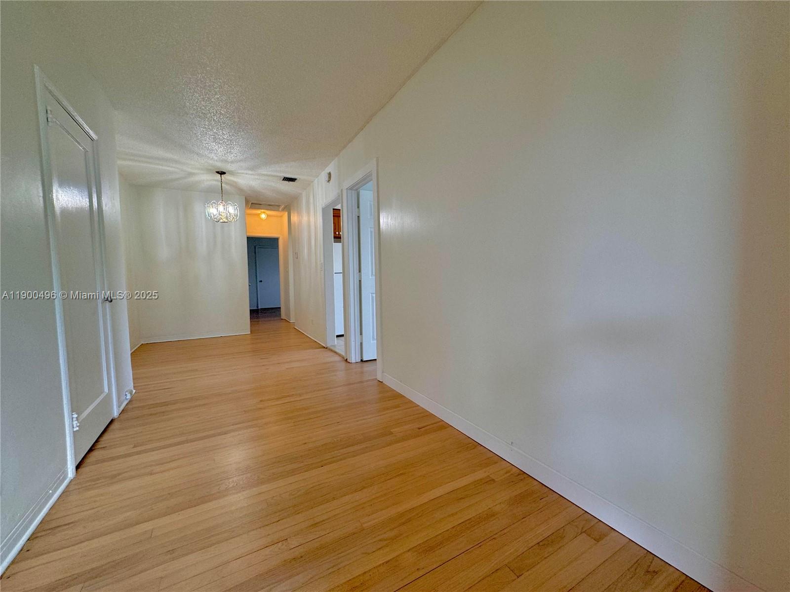 233 Northwest 45th Avenue, Unit 233 Miami, FL 33126 - Photo 2 of 11 a view of hallway with wooden floor