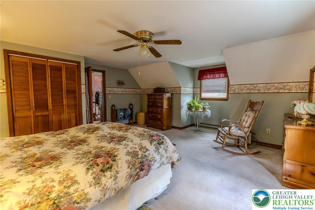 40 Locke Heights Road Bangor, PA 18013 - Photo 24 of 28 Attic bedroom with an angled ceiling offers ample space and comfort.