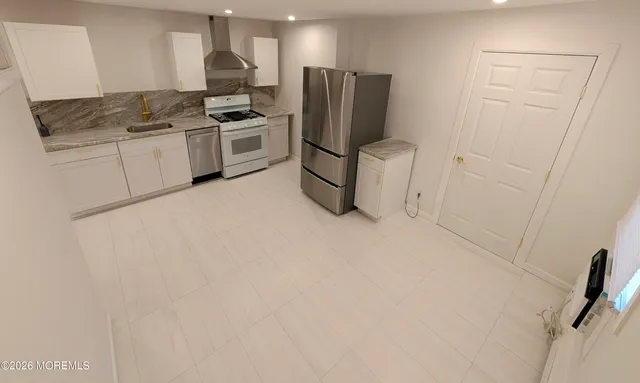 a view of a kitchen with a sink