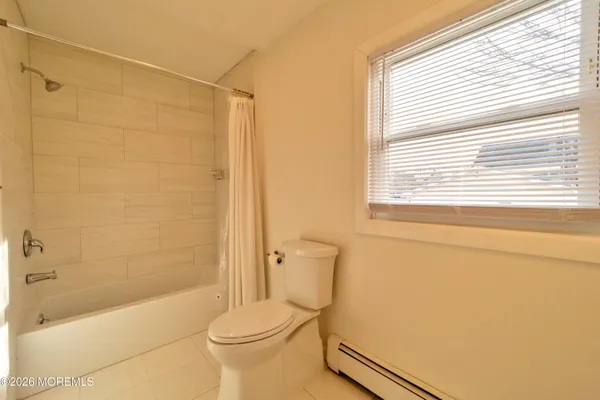a bathroom with a toilet a sink and bathtub