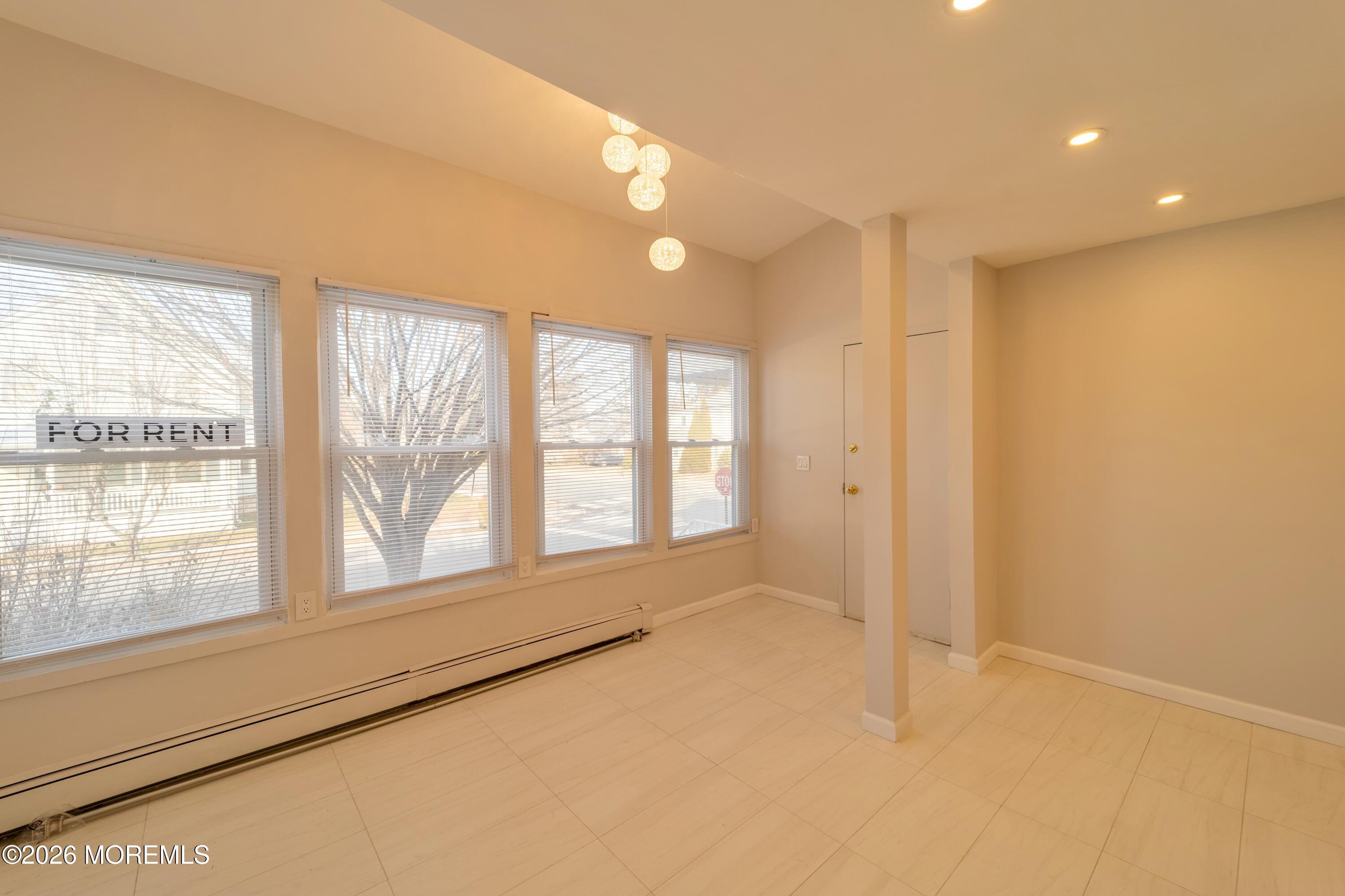 106 Wallace Street, Unit B Red Bank, NJ 07701 - Photo 4 of 20 a view of an empty room with a window