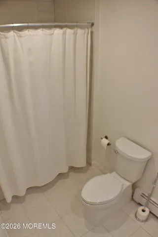 a utility room with cabinets washer and dryer