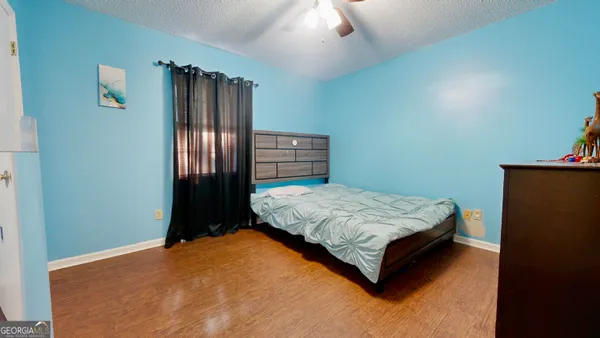 a bedroom with a bed and a closet