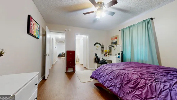 a bed room with a bed and a chandelier