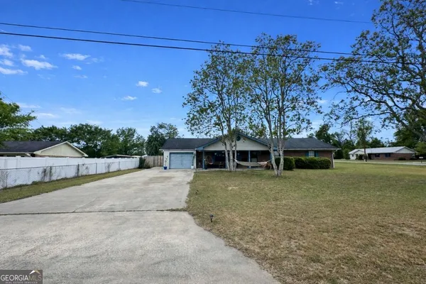 front view of a house with a yard
