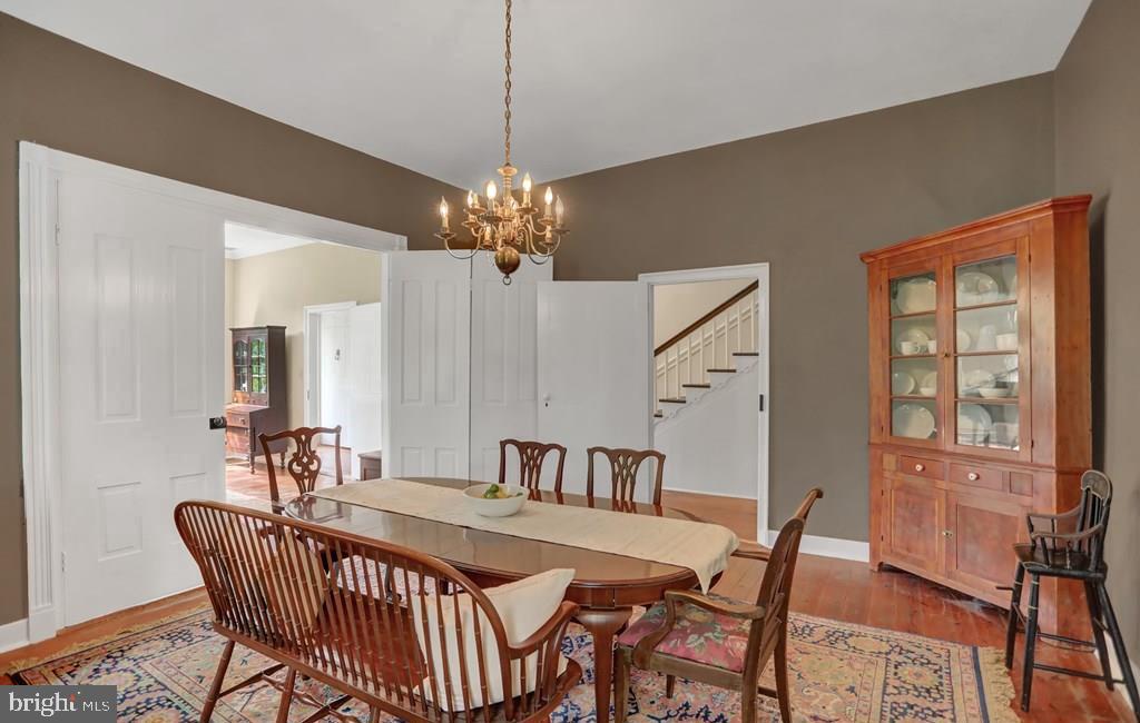 612 Old Rte 322 Spring Mills, PA 16875 - Photo 15 of 78 a dining room with furniture a chandelier and wooden floor