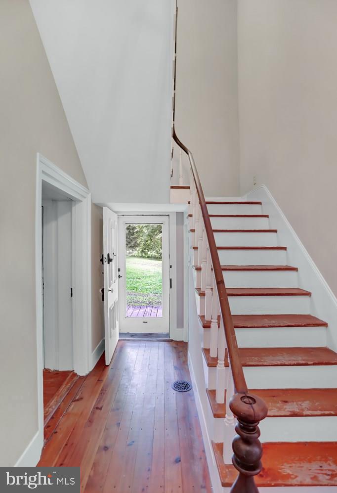 612 Old Rte 322 Spring Mills, PA 16875 - Photo 19 of 78 a view of entryway with wooden floor and stairs