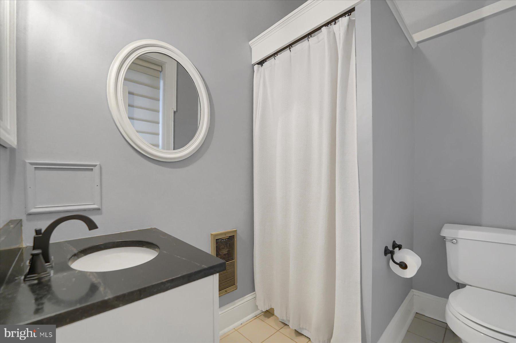 612 Old Rte 322 Spring Mills, PA 16875 - Photo 23 of 78 a bathroom with a granite countertop sink and a mirror