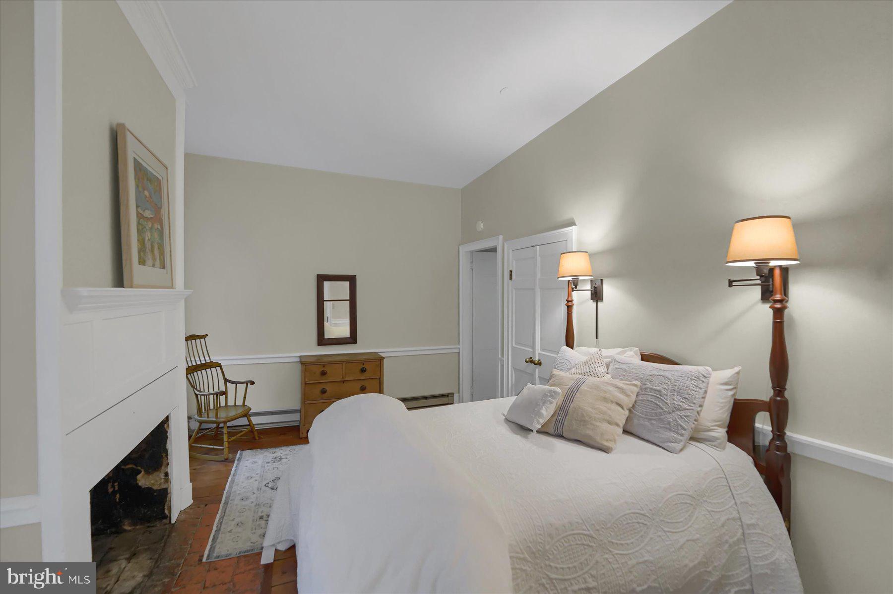 612 Old Rte 322 Spring Mills, PA 16875 - Photo 26 of 78 a bedroom with a bed and a lamp