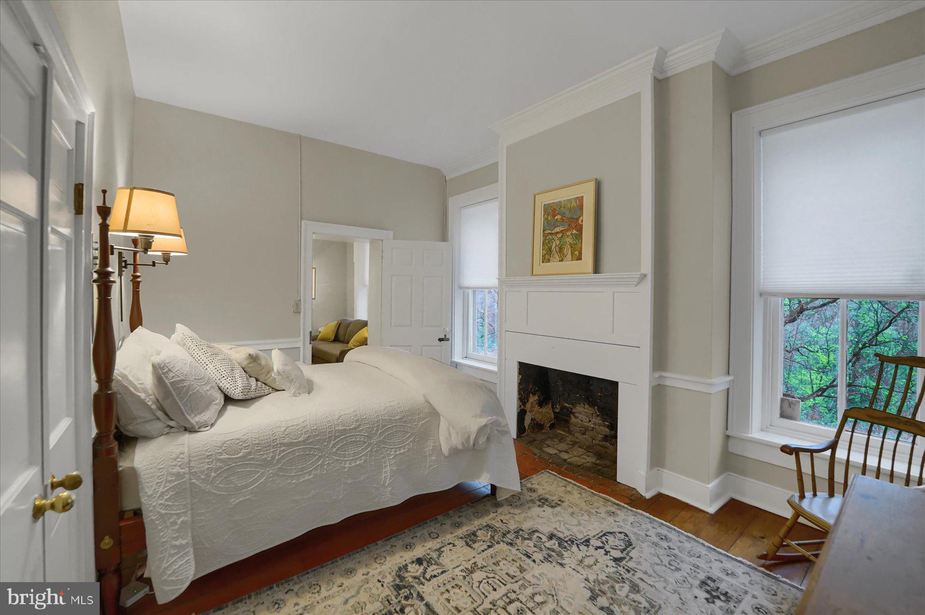 612 Old Rte 322 Spring Mills, PA 16875 - Photo 27 of 78 a bedroom with a bed and a fireplace