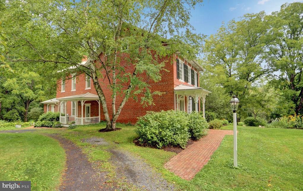 612 Old Rte 322 Spring Mills, PA 16875 - Photo 43 of 78 a front view of a house with a yard