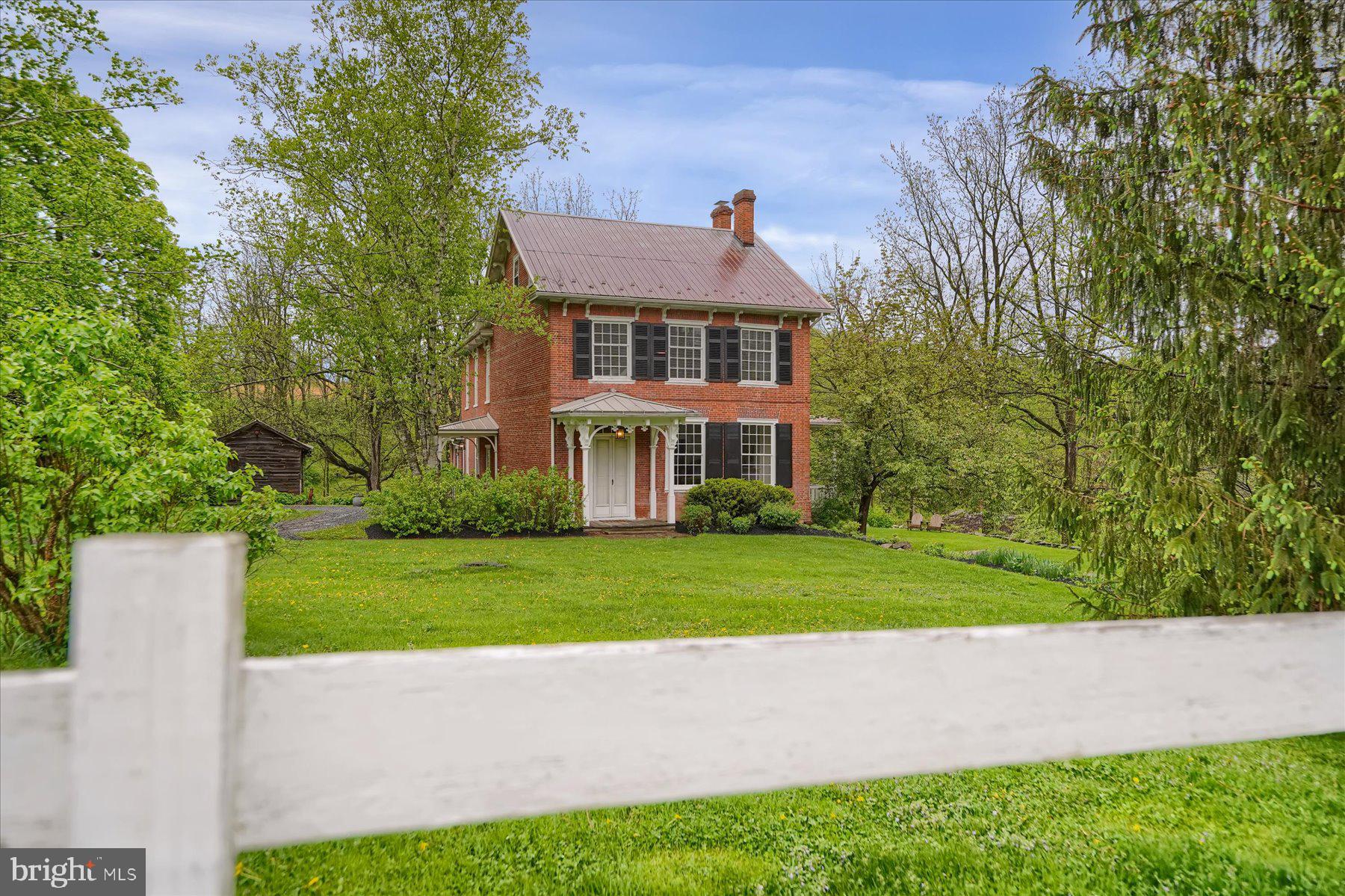 612 Old Rte 322 Spring Mills, PA 16875 - Photo 45 of 78 a front view of a house with a yard