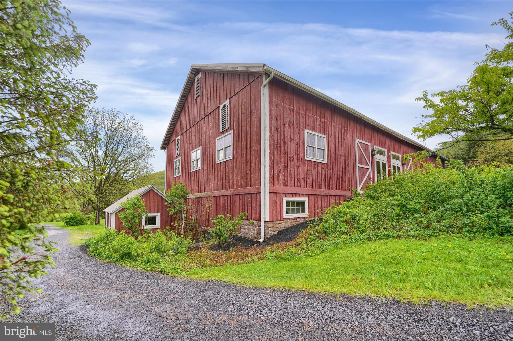 612 Old Rte 322 Spring Mills, PA 16875 - Photo 53 of 78 a view of a brick building next to a yard