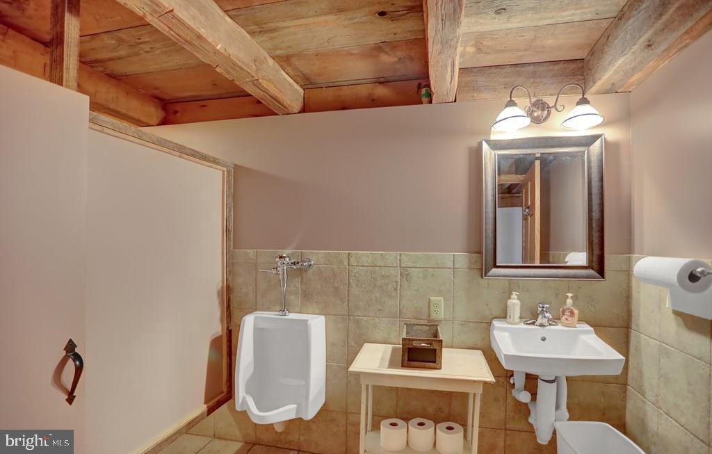 612 Old Rte 322 Spring Mills, PA 16875 - Photo 61 of 78 a bathroom with a sink mirror and toilet