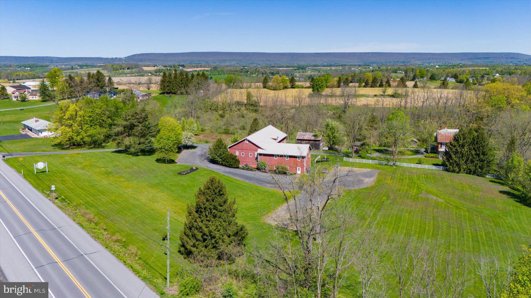 612 Old Rte 322 Spring Mills, PA 16875 - Photo 65 of 78 a view of a lake with a yard