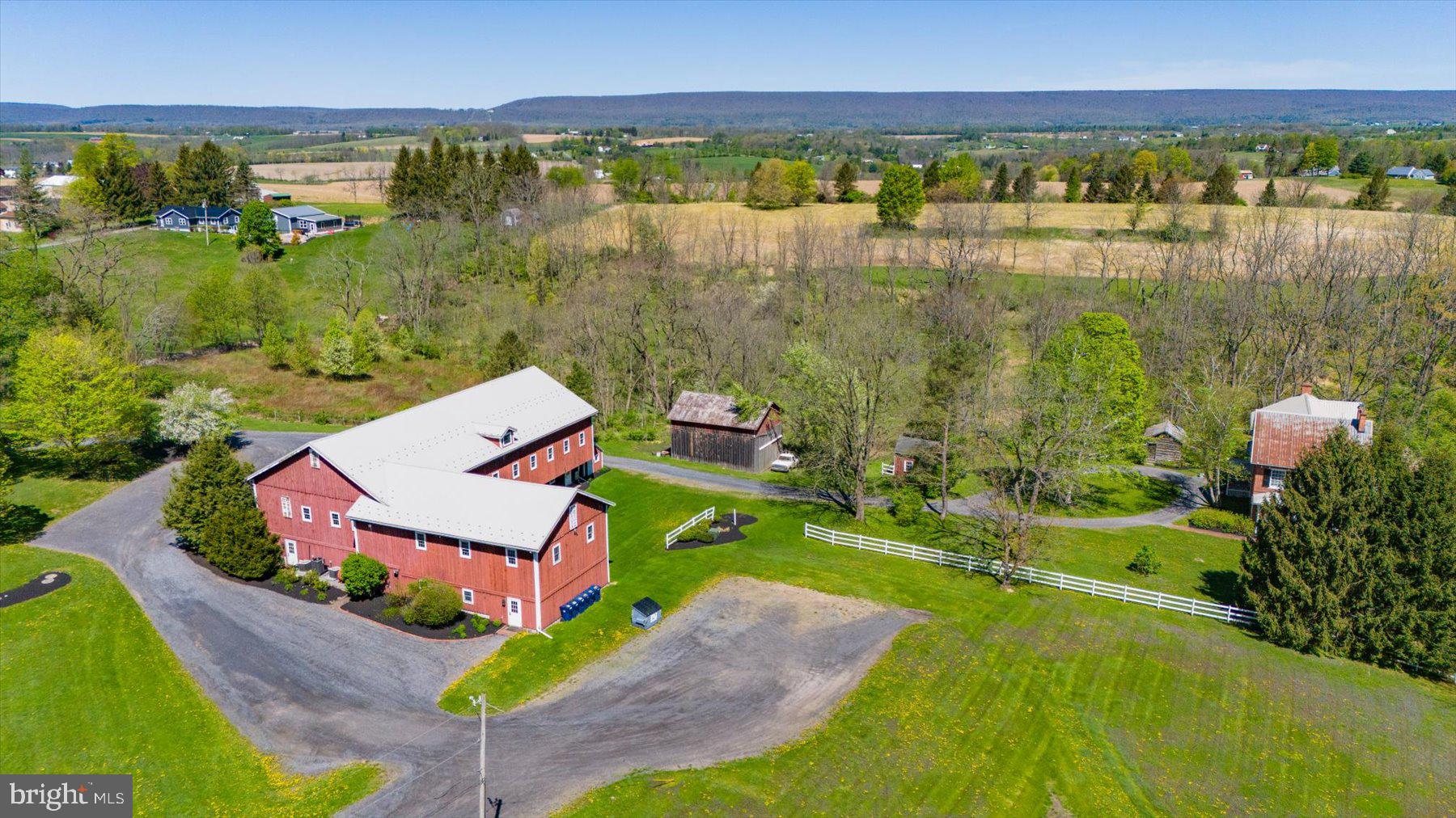612 Old Rte 322 Spring Mills, PA 16875 - Photo 67 of 78 an aerial view of a house with a lake view