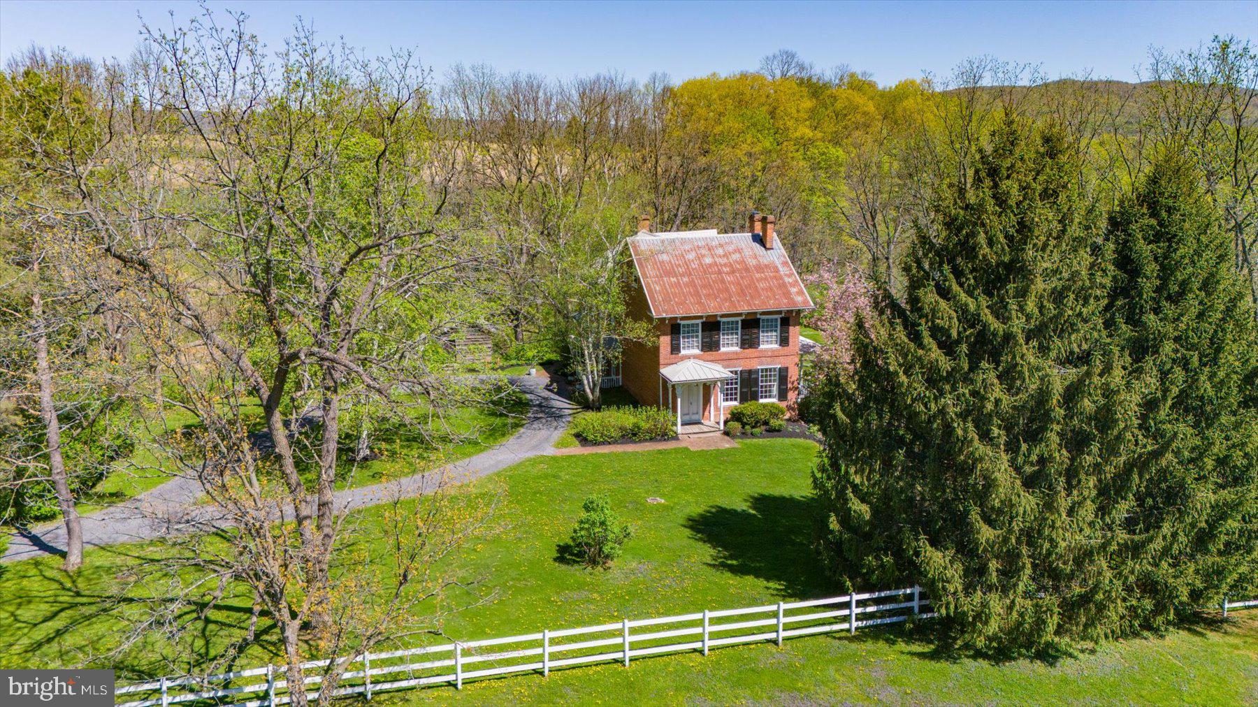 612 Old Rte 322 Spring Mills, PA 16875 - Photo 69 of 78 a view of a garden with a building in the background