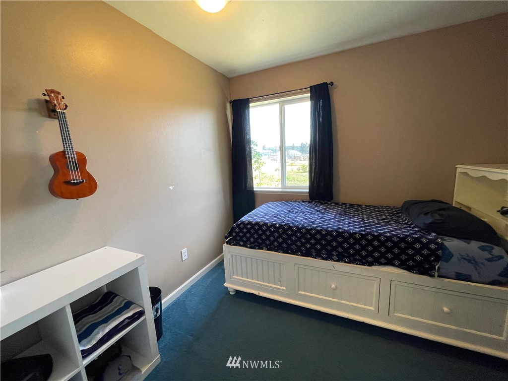 182 West Valley Road Chimacum, WA 98325 - Photo 13 of 35 a bedroom with a bed and cabinets