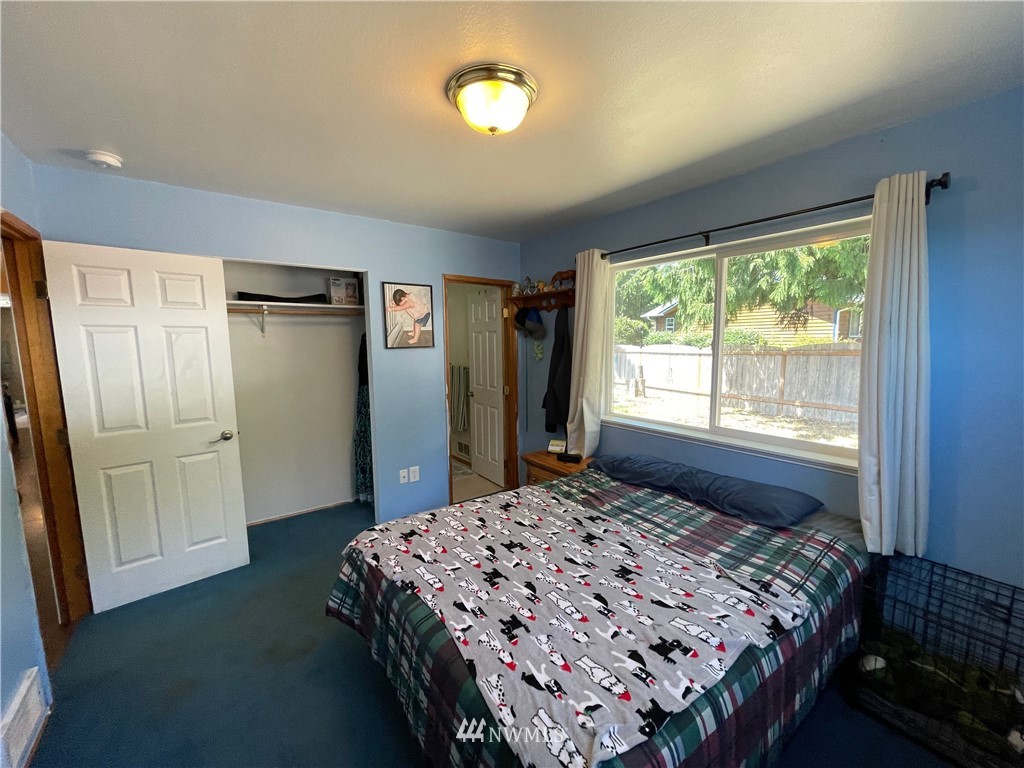 182 West Valley Road Chimacum, WA 98325 - Photo 14 of 35 a bedroom with a bed and a window