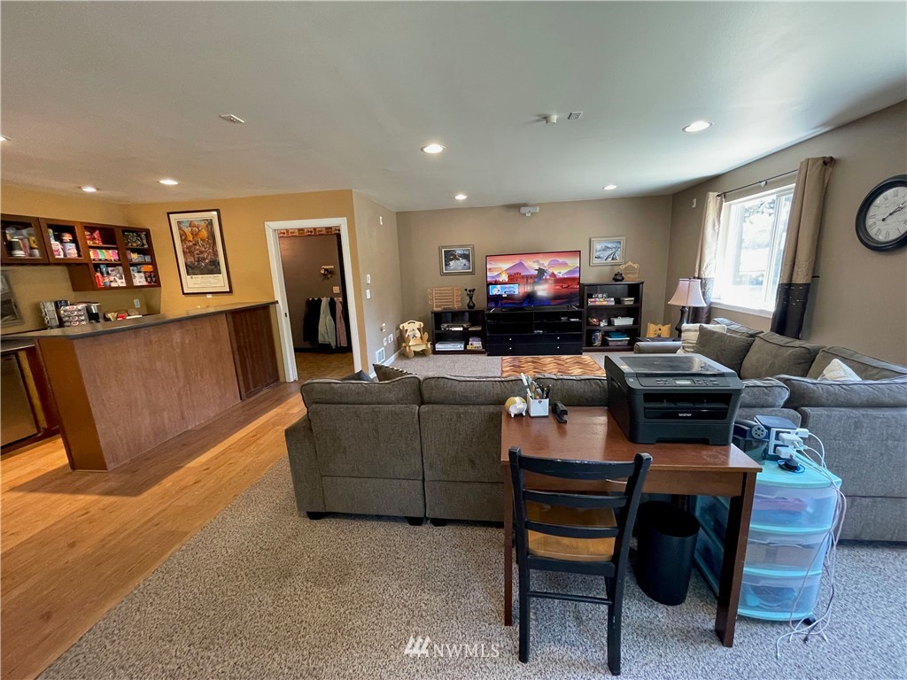 182 West Valley Road Chimacum, WA 98325 - Photo 24 of 35 a living room with furniture and a flat screen tv