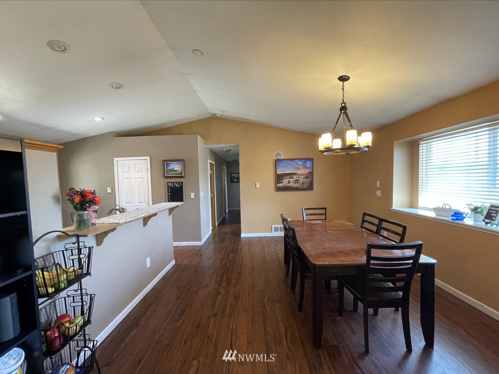 182 West Valley Road Chimacum, WA 98325 - Photo 8 of 35 a view of a dining room with furniture window and wooden floor