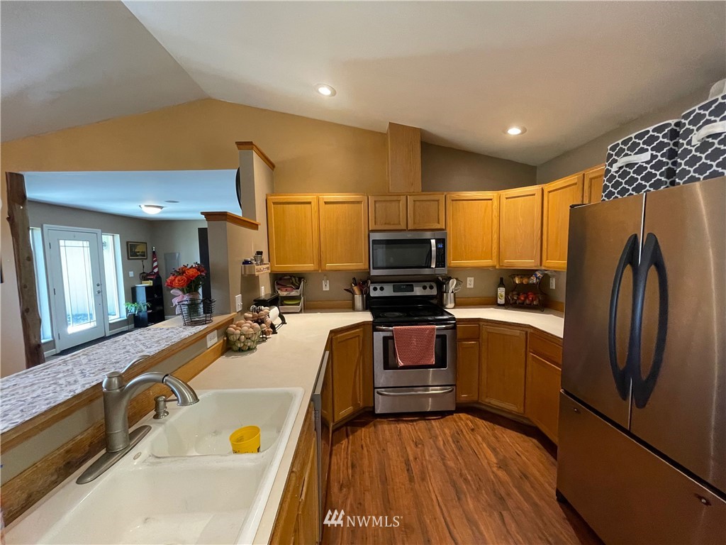 182 West Valley Road Chimacum, WA 98325 - Photo 10 of 35 a kitchen with stainless steel appliances a refrigerator sink and microwave