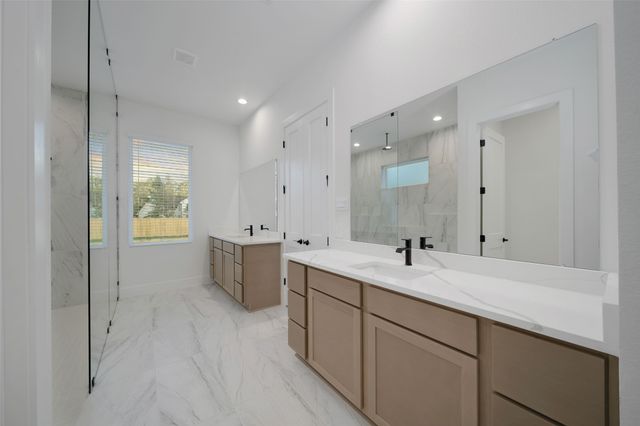 a bathroom with a shower and a sink