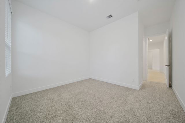 a bathroom with a shower sink vanity mirror and toilet