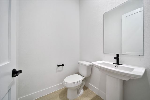 a bathroom with a sink and vanity