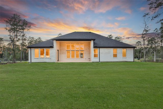 an aerial view of a house with outdoor space