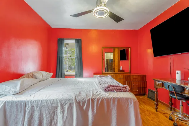 a kitchen with stainless steel appliances granite countertop a dining table chairs a sink and dishwasher a refrigerator with wooden floor