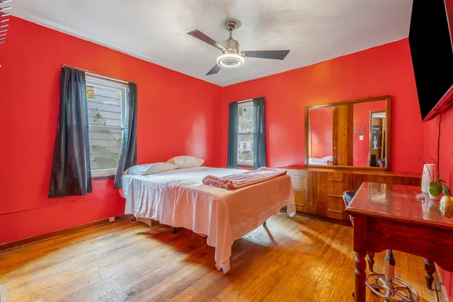 a kitchen with a stove a sink a microwave and wooden cabinets