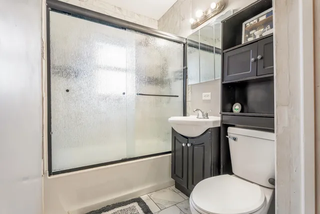 a view of a livingroom with wooden furniture
