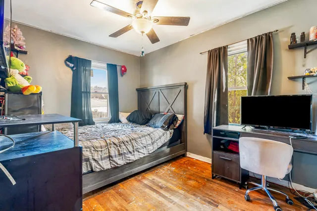 a bedroom with a bed and window