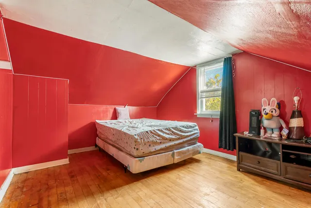 a view of room with wooden floor