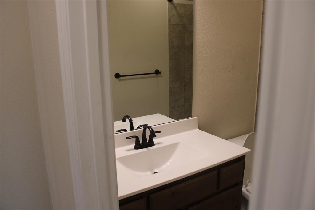 536 Hidden Spgs Trail Azle, TX 76020 - Photo 12 of 21 a bathroom with a sink and vanity