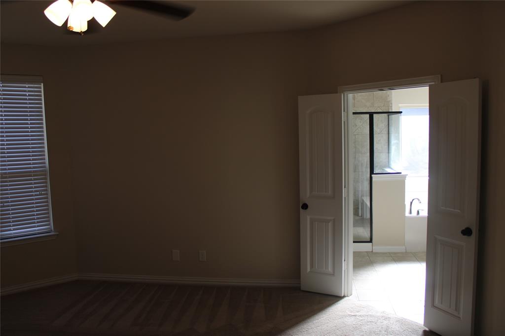 536 Hidden Spgs Trail Azle, TX 76020 - Photo 14 of 21 wooden floor in an empty room with a window
