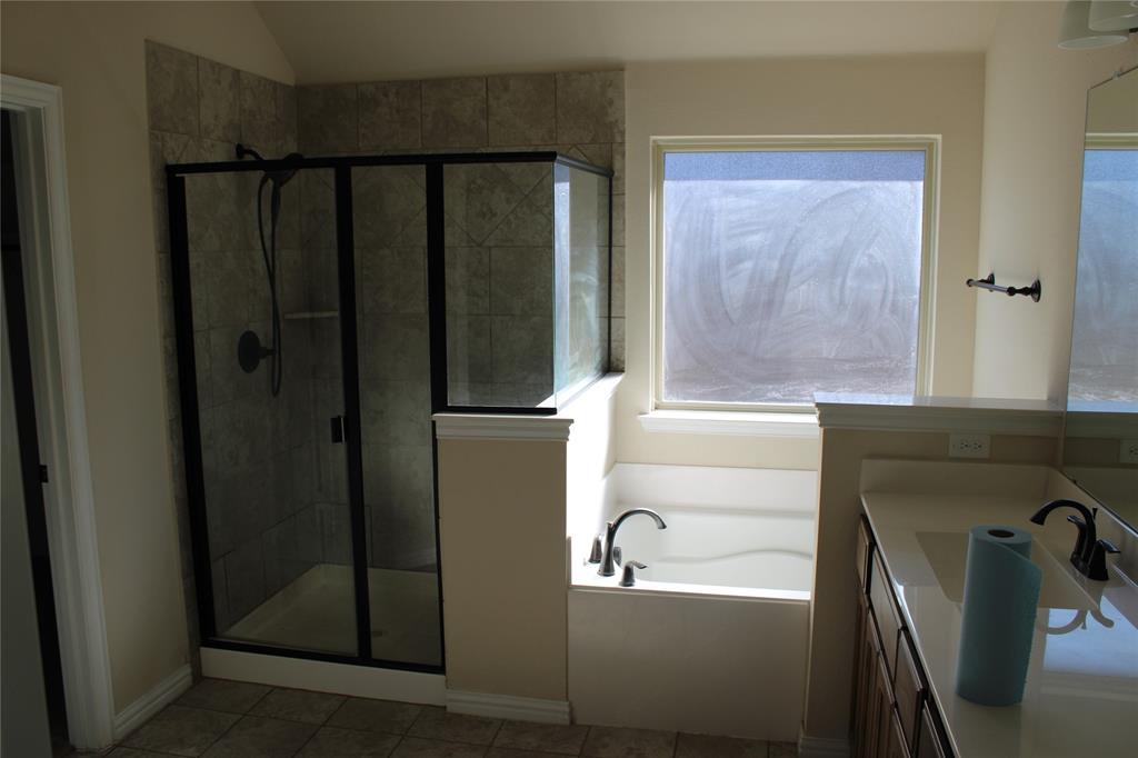 536 Hidden Spgs Trail Azle, TX 76020 - Photo 15 of 21 a bathroom with a bathtub and a shower