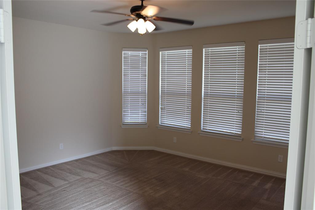 536 Hidden Spgs Trail Azle, TX 76020 - Photo 17 of 21 an empty room with wooden floor and windows