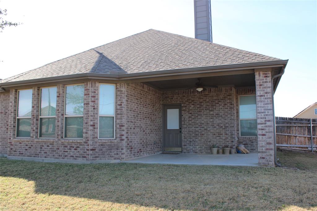536 Hidden Spgs Trail Azle, TX 76020 - Photo 18 of 21 a front view of a house with garden