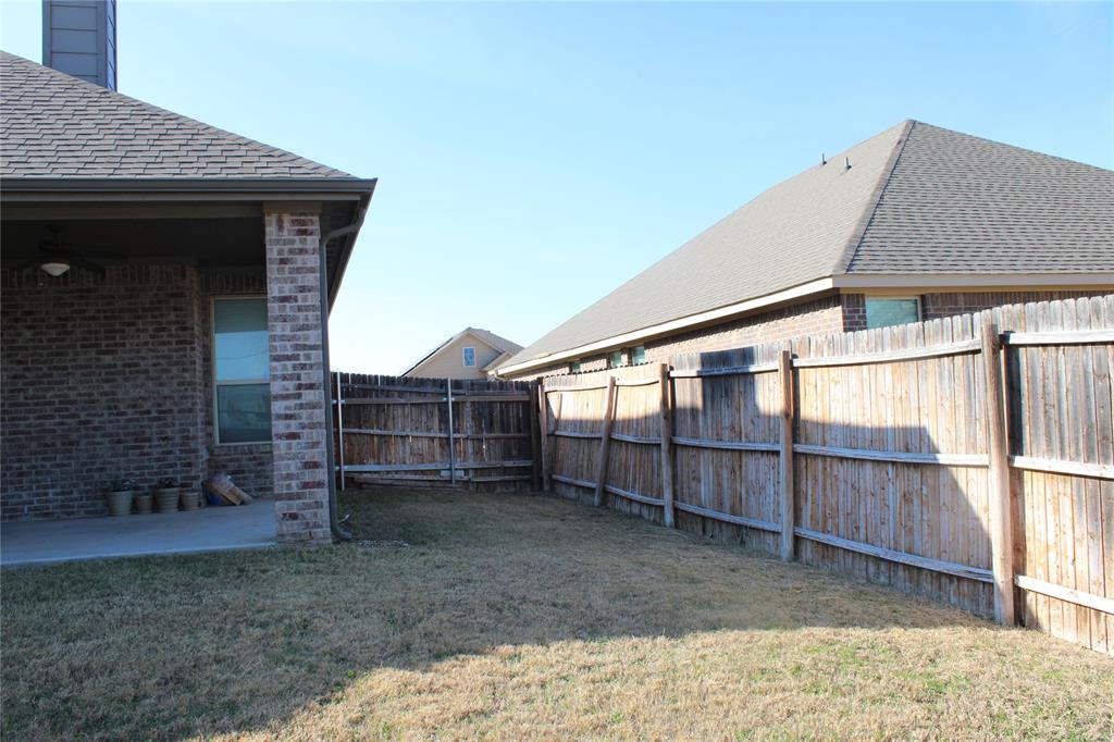536 Hidden Spgs Trail Azle, TX 76020 - Photo 20 of 21 a view of a house with a yard