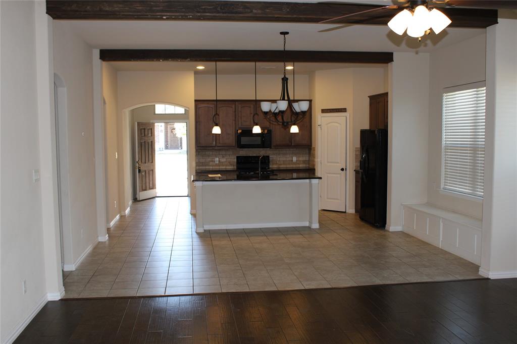 536 Hidden Spgs Trail Azle, TX 76020 - Photo 3 of 21 a view of a kitchen with cabinets and wooden floor