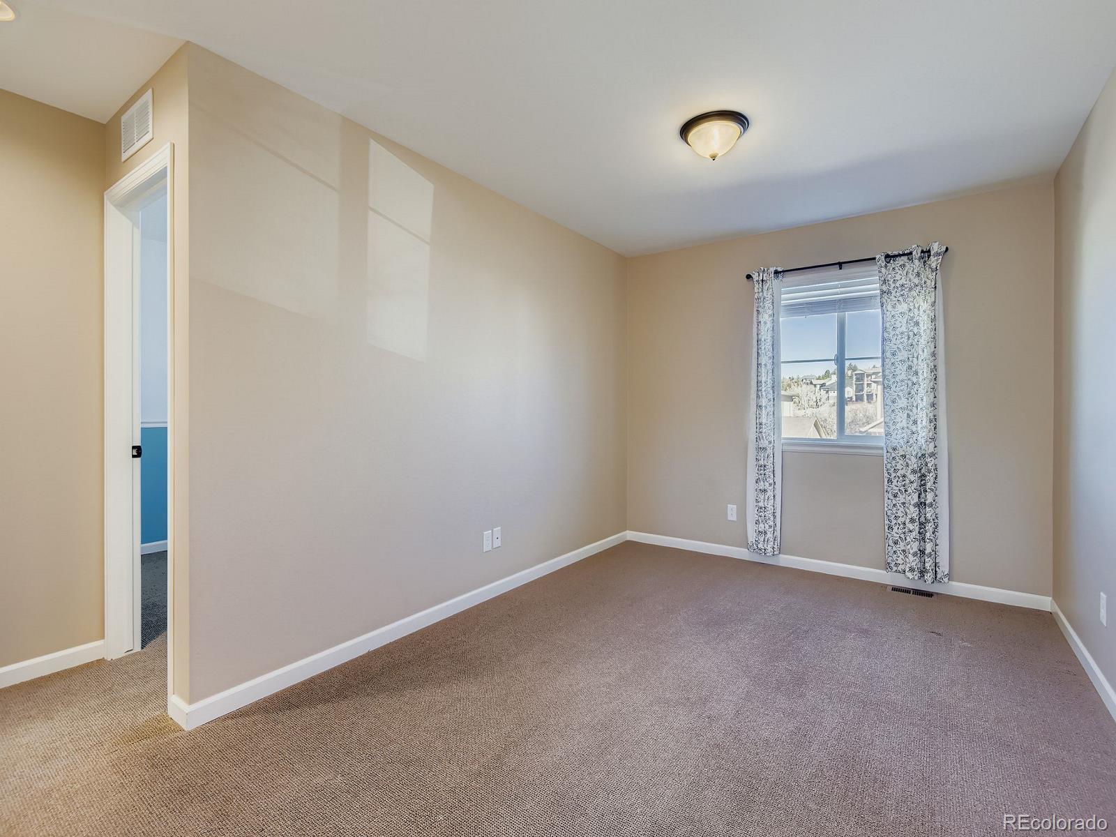 3839 Donnington Circle Castle Rock, CO 80104 - Photo 18 of 31 a view of an empty room with a window