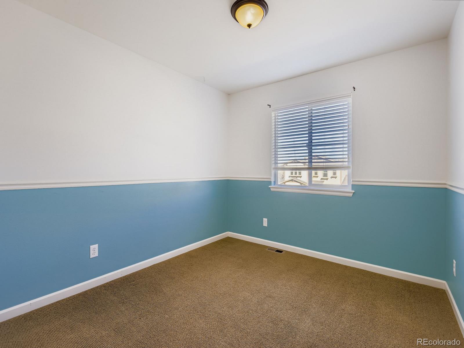 3839 Donnington Circle Castle Rock, CO 80104 - Photo 20 of 31 an empty room with windows