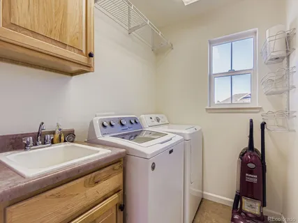 a utility room with dryer and washer