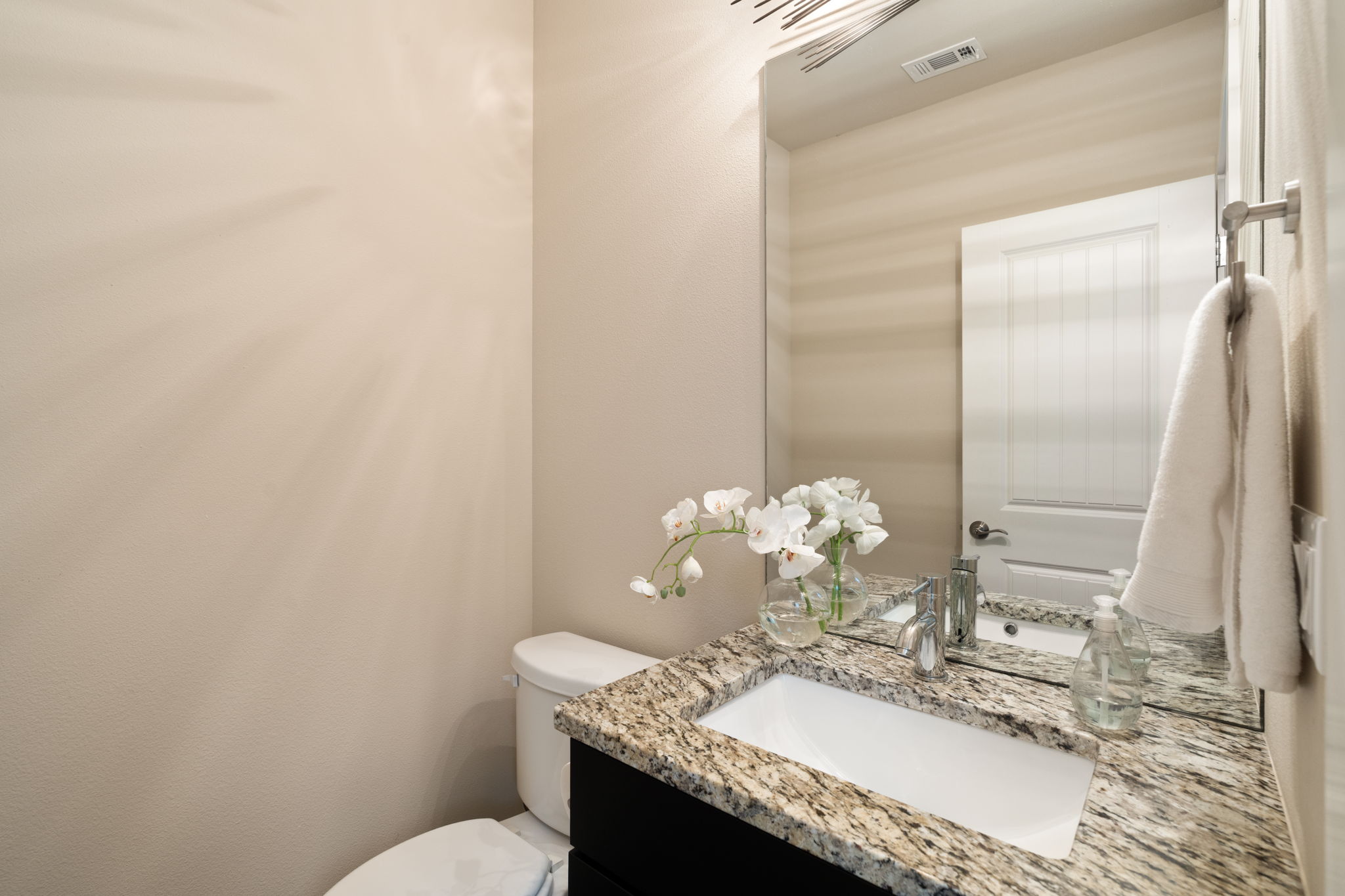 8110 Ranch Road 2222, Unit 81 Austin, TX 78730 - Photo 13 of 28 a bathroom with a granite countertop sink and a mirror