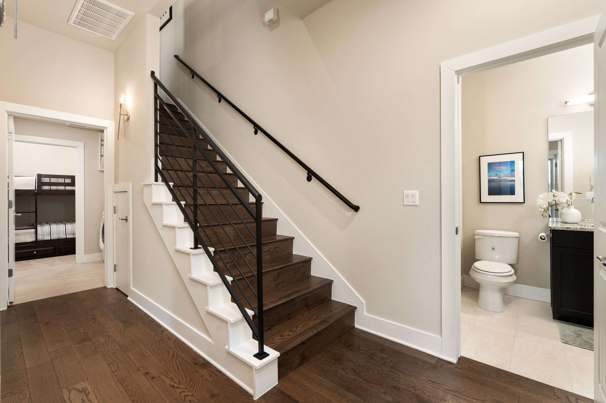 8110 Ranch Road 2222, Unit 81 Austin, TX 78730 - Photo 14 of 28 a view of a hallway with wooden floor and staircase